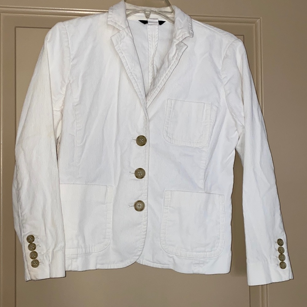 Women’s off white jacket.